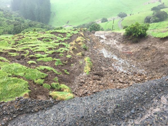 Banks Peninsula storm slip taking out road, drive and conservation work